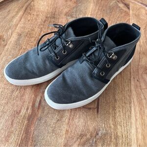 Timberland women’s chukka-style boots in classic black canvas.